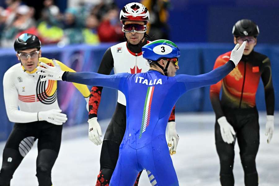 Italy's Pietro Sighel passes the finish line backwards