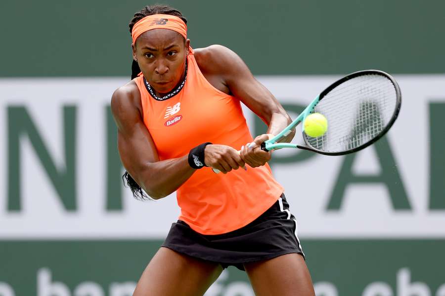 Coco Gauff of the USA returns a shot to Rebecca Peterson of Sweden