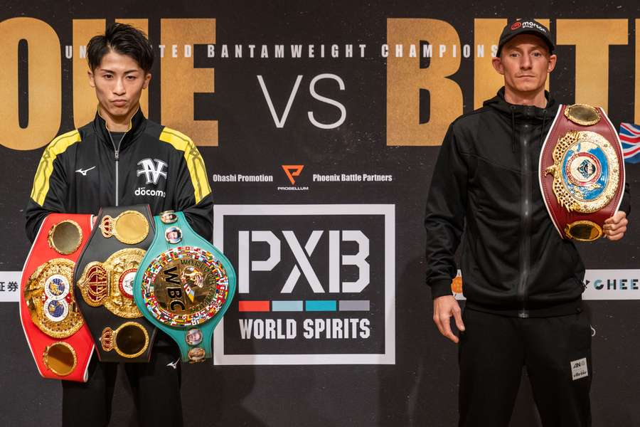 Japan’s Naoya Inoue (L) and Britain’s Paul Butler pose for photographs during a press conference