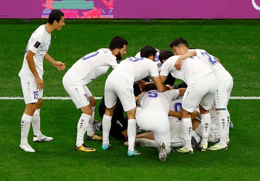 Uzbekistan celebrate scoring the equaliser