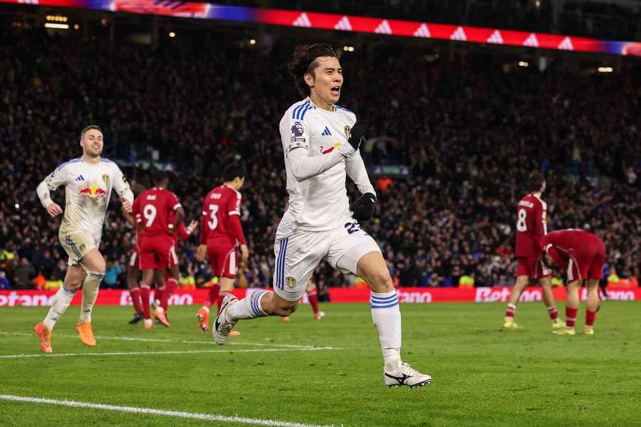 Tanaka celebrates after scoring 