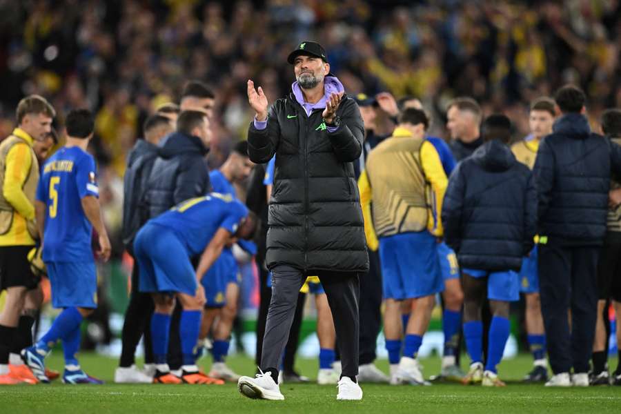 Jurgen Klopp applauds fans on the pitch after the UEFA Europa League group E football match between Liverpool and Royale Union