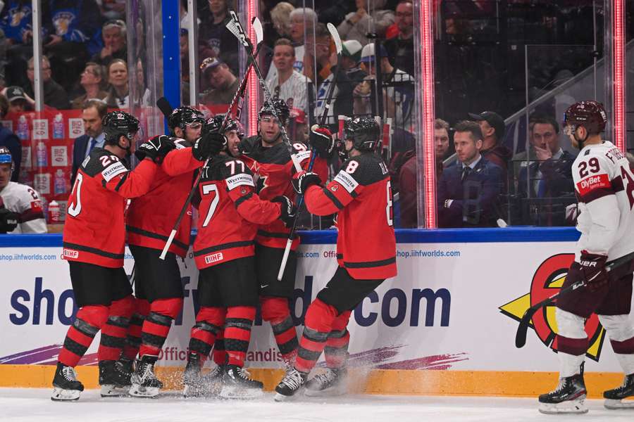 Canada celebrate scoring against Latvia