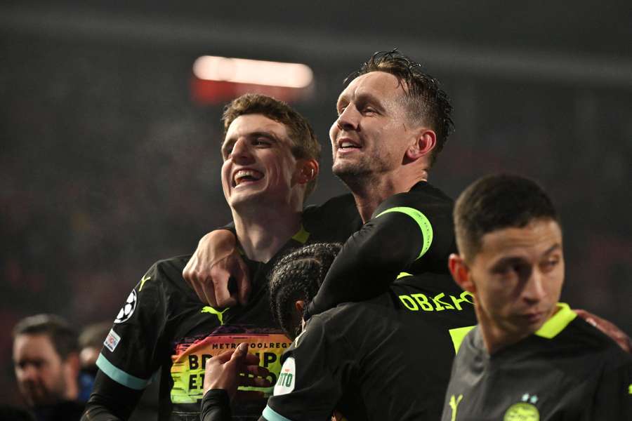 Guus Til (L) and Luuk de Jong celebrate PSV's win away at Red Star Belgrade