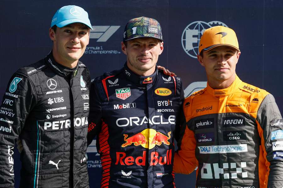 Mercedes' George Russell (L), Red Bull's Max Verstappen and McLaren's Lando Norris pose after taking the leading positions in the qualifying session