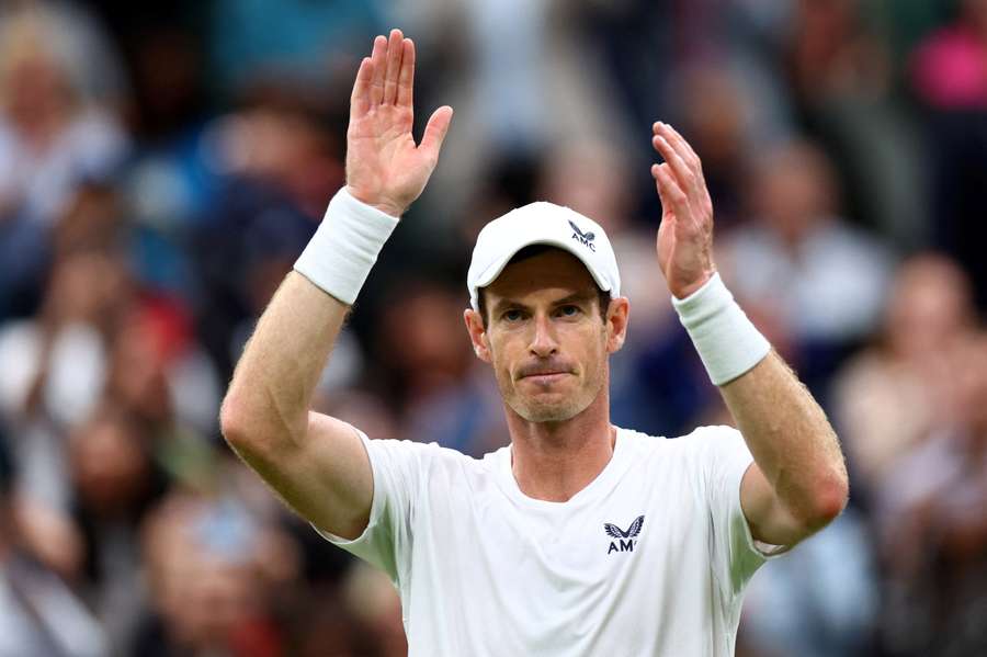 Andy Murray eased past Ryan Peniston in the first round at Wimbledon