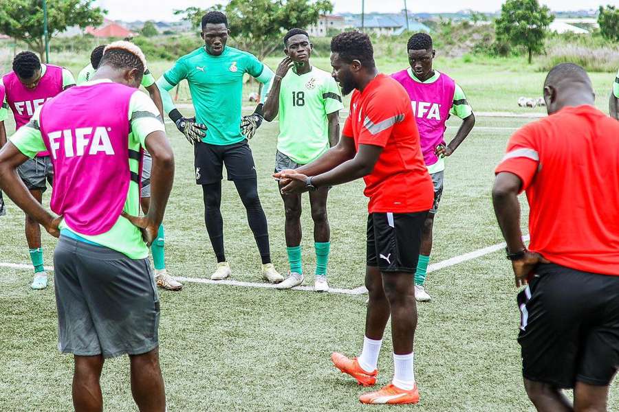 Ofei advises his players during training