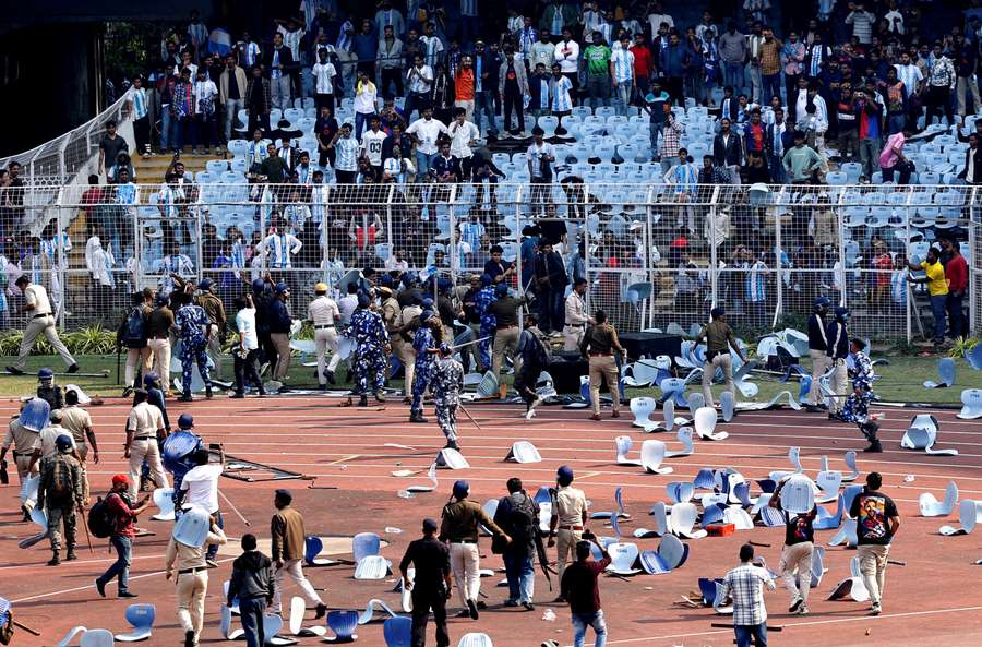 Security and police clash with fans Security and police clash with fans