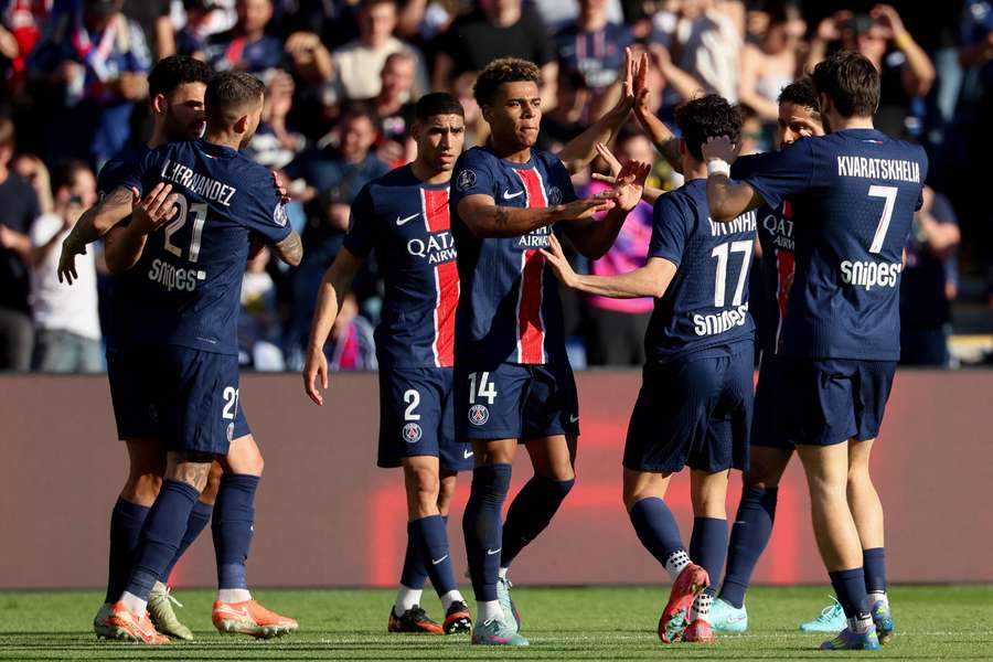PSG players celebrate their winning goal against Angers