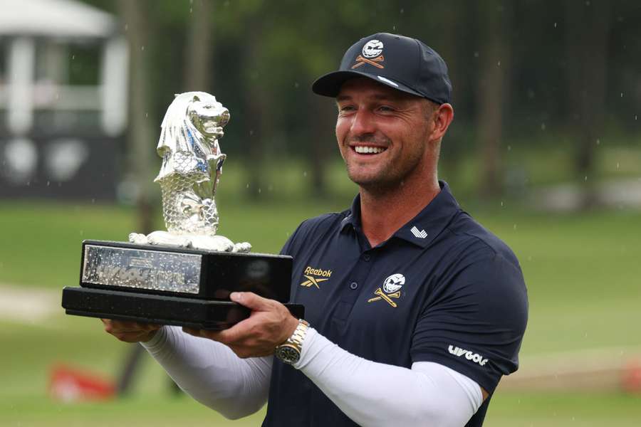 Bryson DeChambeau celebrates with his trophy after winning LIV Golf Singapore Bryson DeChambeau celebrates with his trophy after winning LIV Golf Singapore