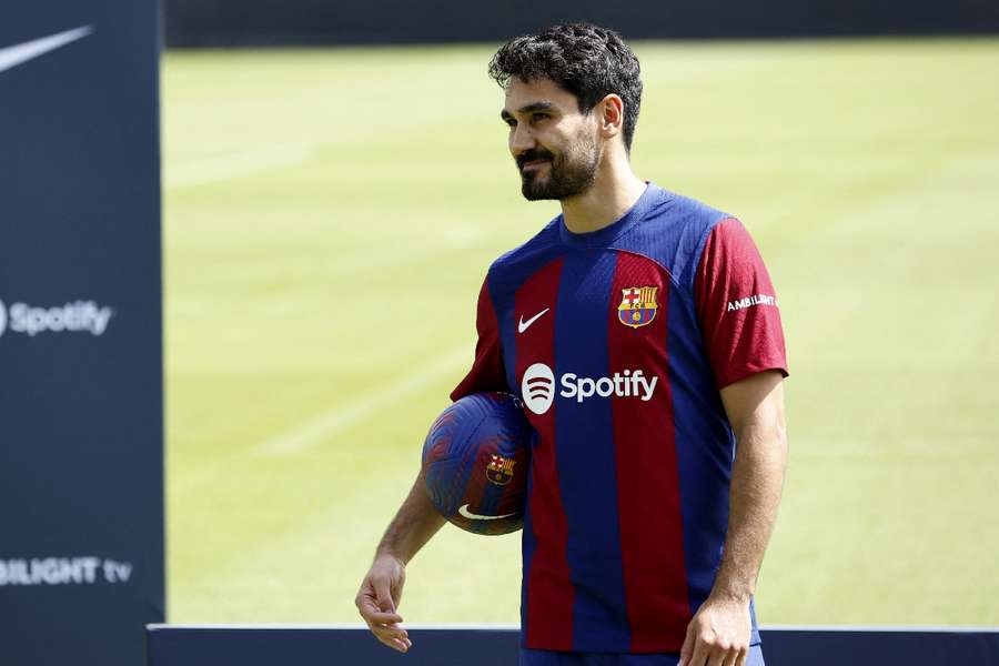 Gundogan poses during the presentation