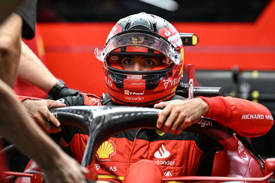 Ferrari's Spanish driver Carlos Sainz Jr gets in his car before a practice session ahead of the Formula One Singapore Grand Prix