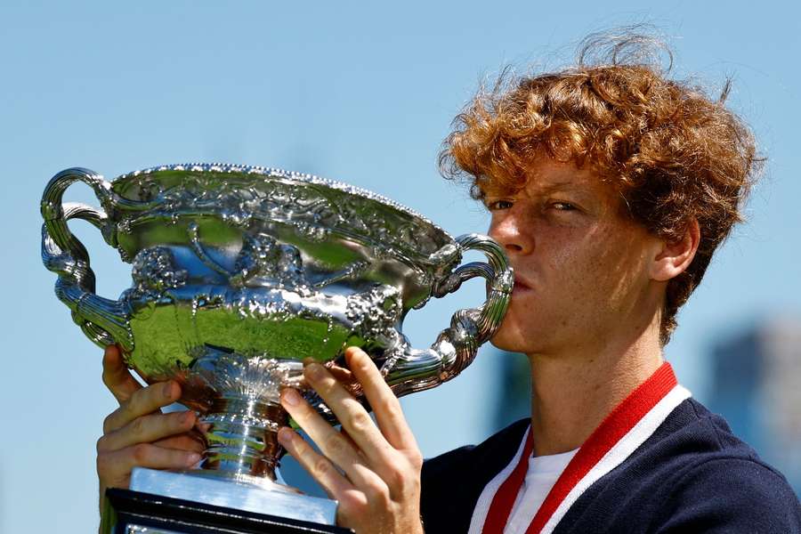 Sinner holding his Australian Open trophy 