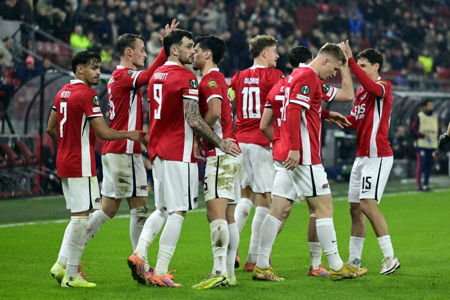 AZ Alkmaar players celebrate their opening goal AZ Alkmaar players celebrate their opening goal