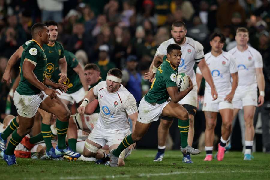 South Africa's scrum-half Grant Williams runs to score a try South Africa's scrum-half Grant Williams runs to score a try
