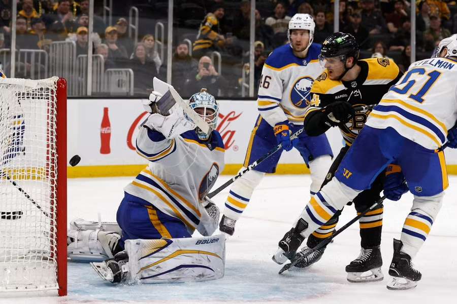 Bruins centre Lauko watches as his shot gets past Sabres goaltender Luukkonen