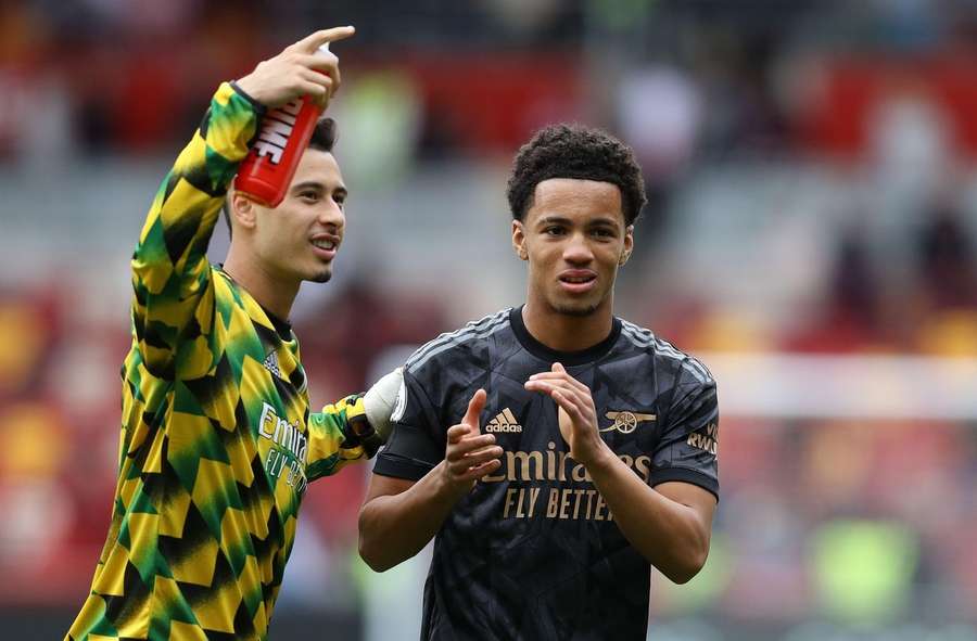 Ethan Nwaneri (R) of Arsenal applauds the fans