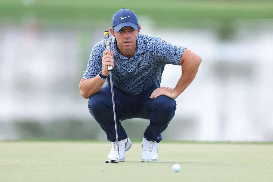 Rory McIlroy of Northern Ireland lines up a putt