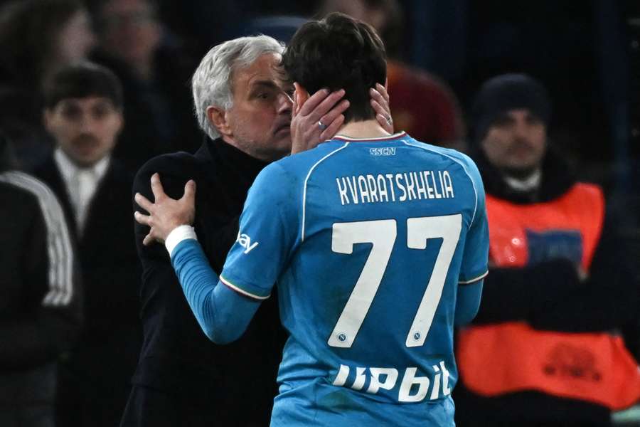 Roma coach Jose Mourinho speaks to Napoli striker Khvicha Kvaratskhelia