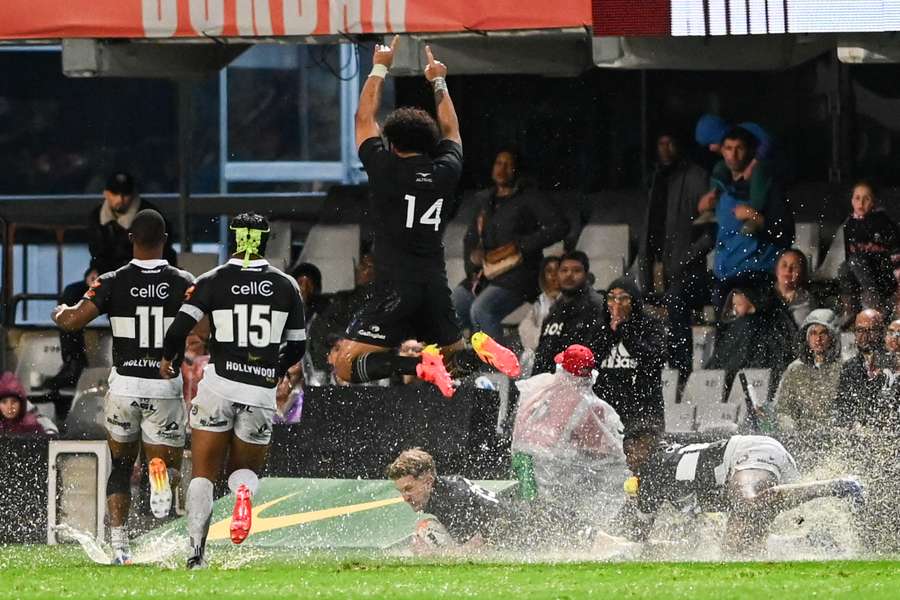 Damian McKenzie goes to ground at a wet and slippery Kings Park Stadium. Damian McKenzie goes to ground at a wet and slippery Kings Park Stadium.