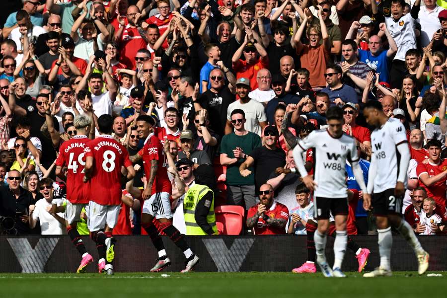 Manchester United's English striker Jadon Sancho celebrates after scoring his team's first goal