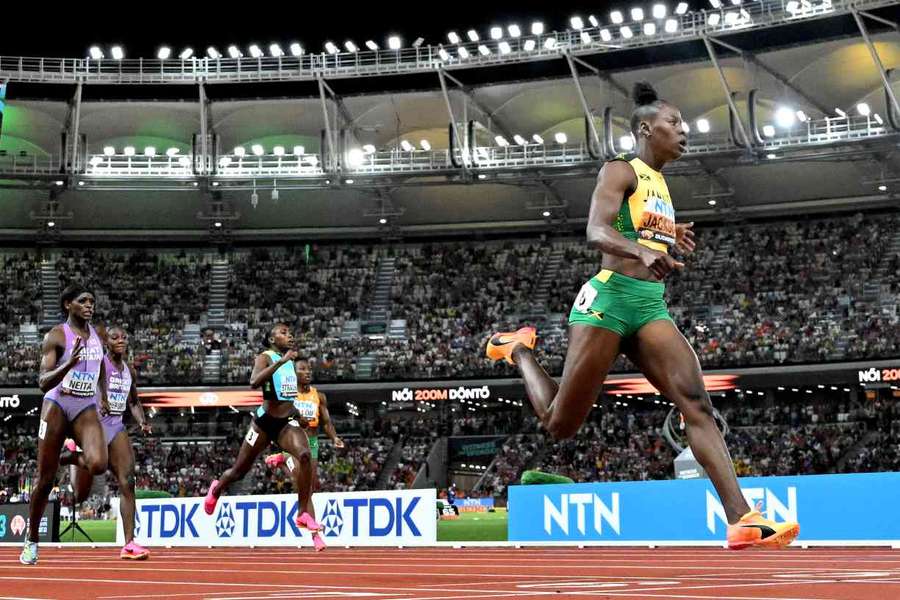 Shericka Jackson crosses the finish line to win the women's 200m final