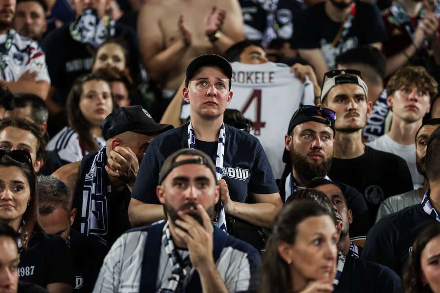 Bordeaux fans react as the game against Rodez is abandoned