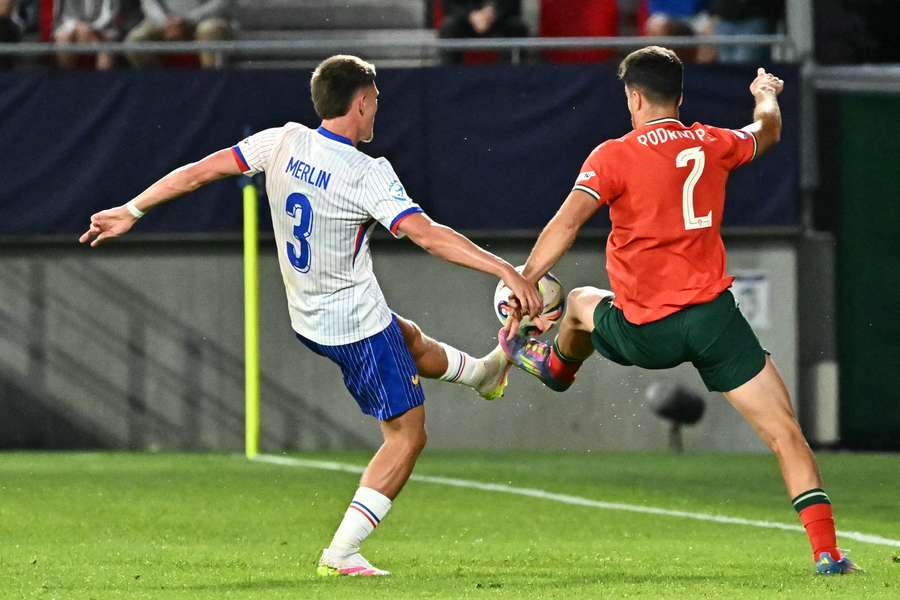 Quentin Merlin and Portugal's defender Rodrigo Pinheiro vie for the ball