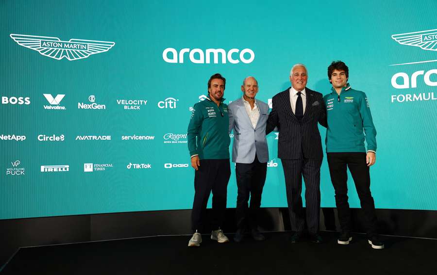 Aston Martin chairperson Lawrence Stroll with drivers Lance Stroll and Fernando Alonso, and new managing technical partner Adrian Newey