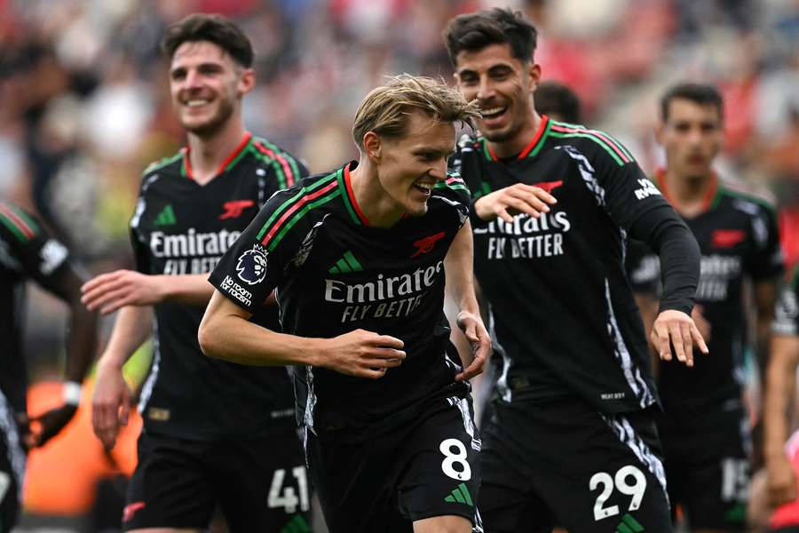Martin Odegaard celebrates with teammates after scoring the winning goal for Arsenal against Southampton