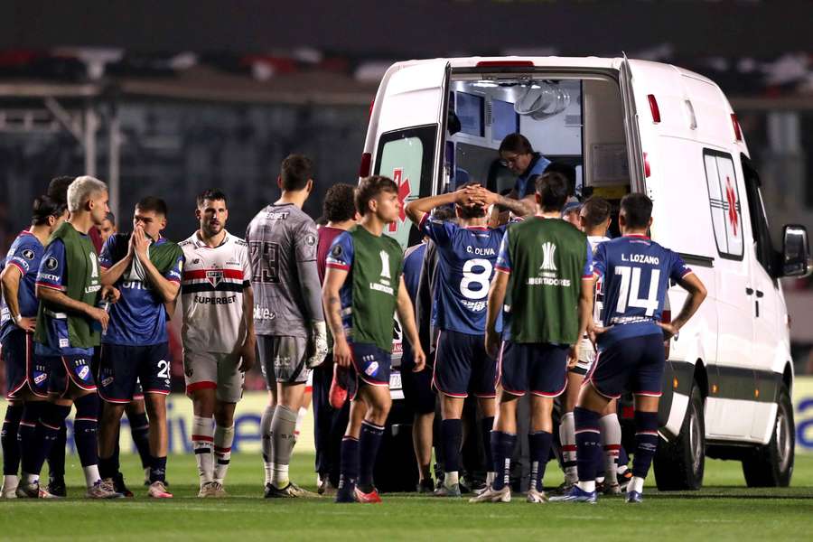 Nacional's Juan Izquierdo is taken off the pitch