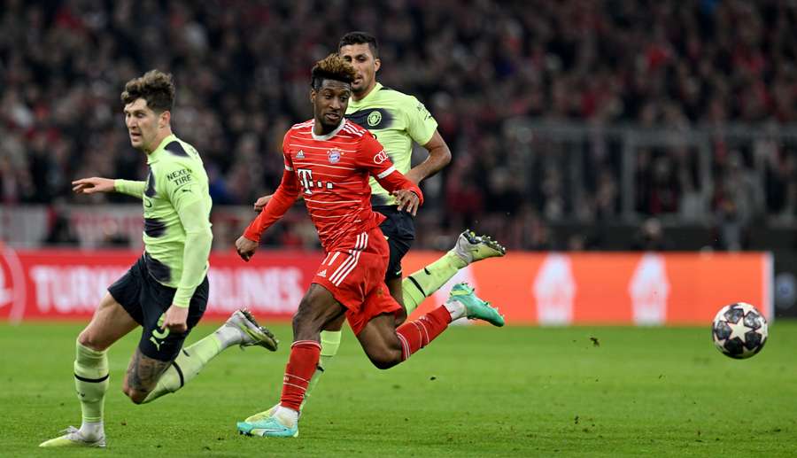 Kingsley Coman, John Stones and Rodri vie for the ball Kingsley Coman, John Stones and Rodri vie for the ball
