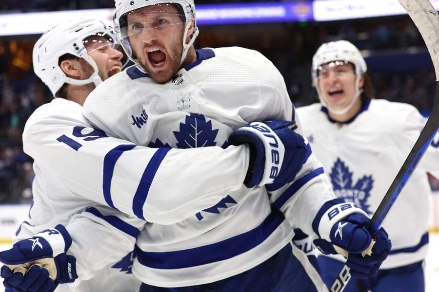 Maple Leaf centre Kerfoot celebrates after he scored the game-winning goal