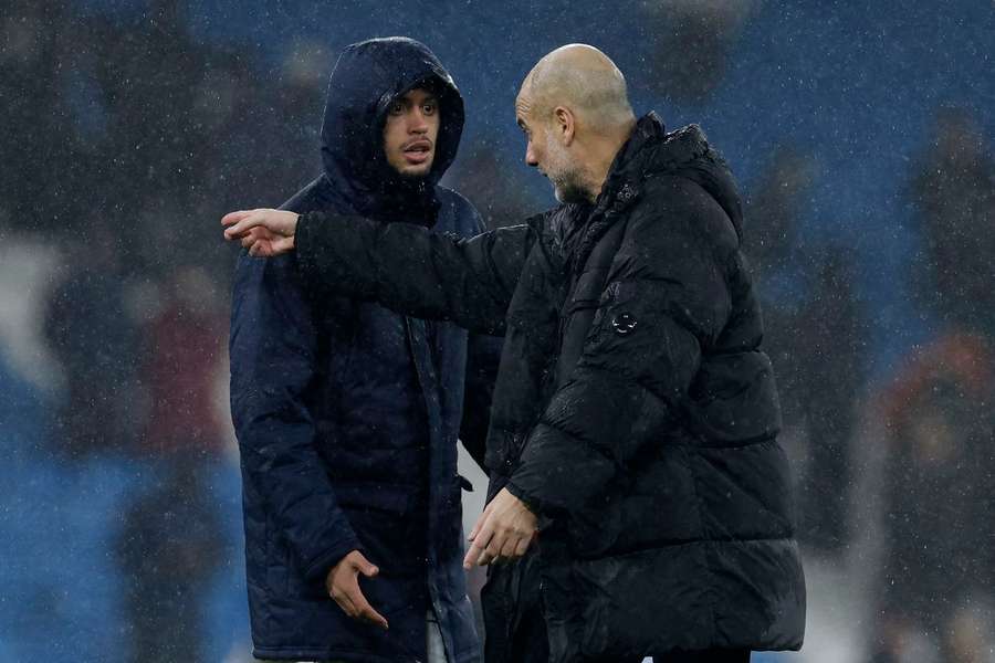 Guardiola giving instructions to Matheus Nunes
