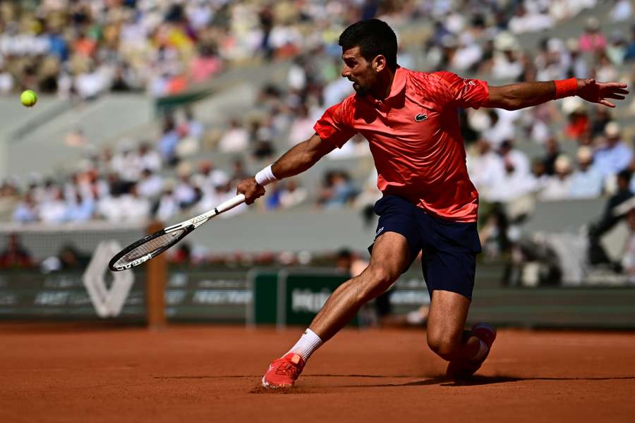 Serbia's Novak Djokovic plays a backhand return