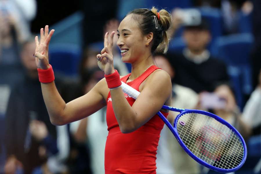 Zheng celebrates her victory