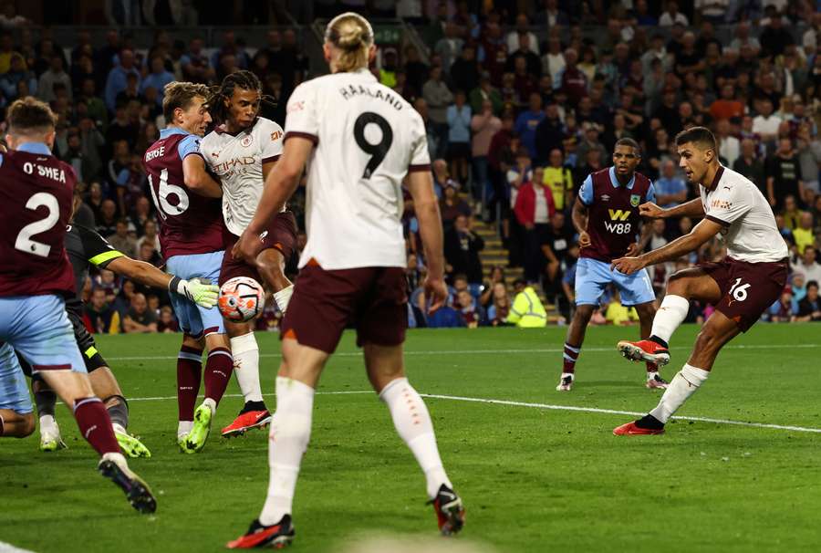 Manchester City's Spanish midfielder Rodri scores his team third goal