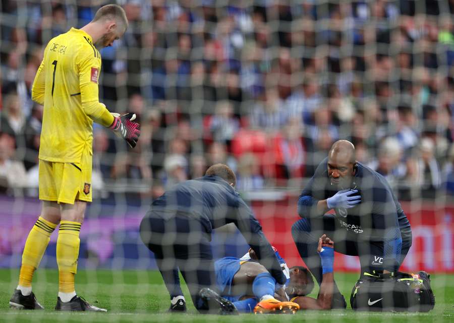 Brighton's English striker Danny Welbeck receives medical treatment before being substituted off injured Brighton's English striker Danny Welbeck receives medical treatment before being substituted off injured