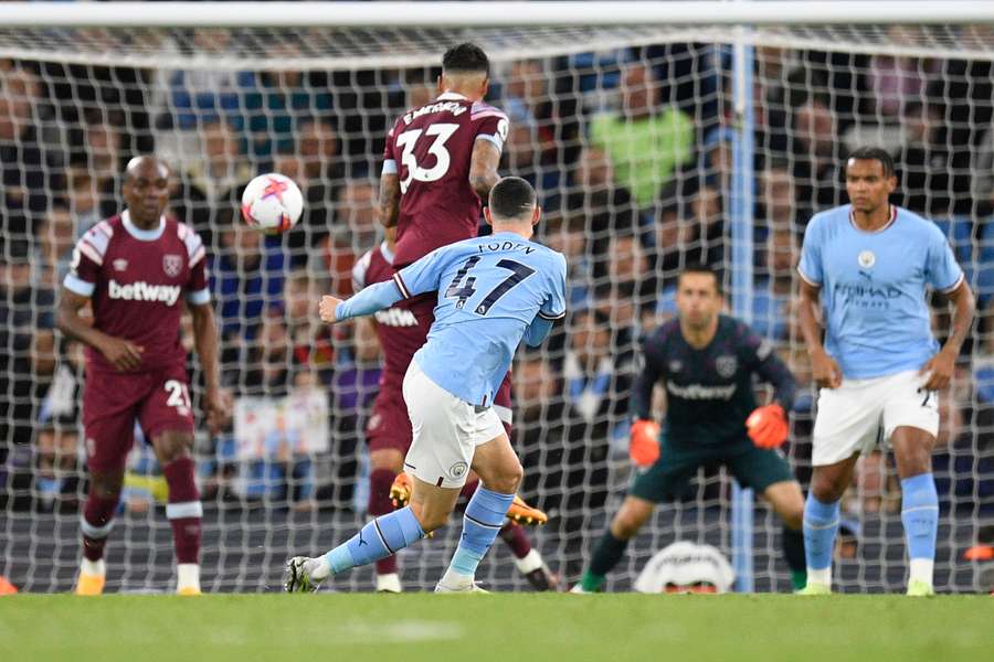 Phil Foden scores Man City's third goal with a deflected strike