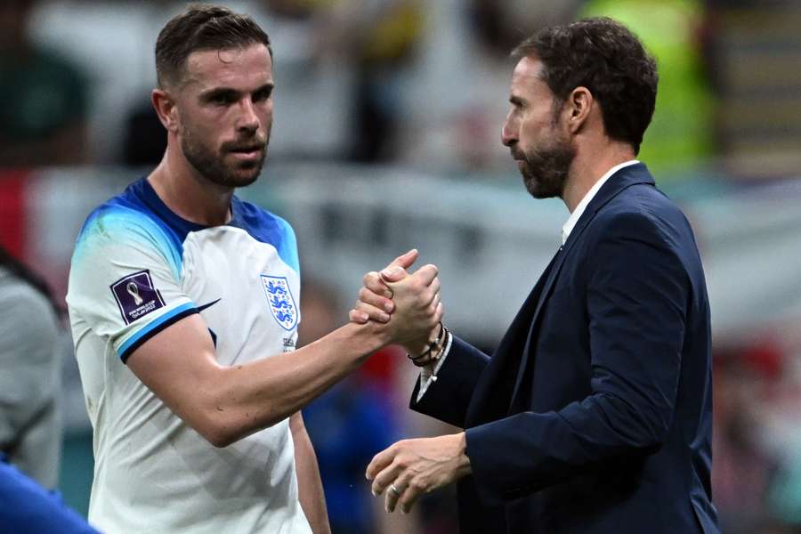 Gareth Southgate congratulates England's midfielder Jordan Henderson as he is substituted