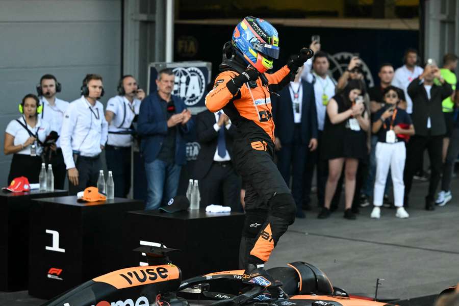 Oscar Piastri celebrates after winning in Baku