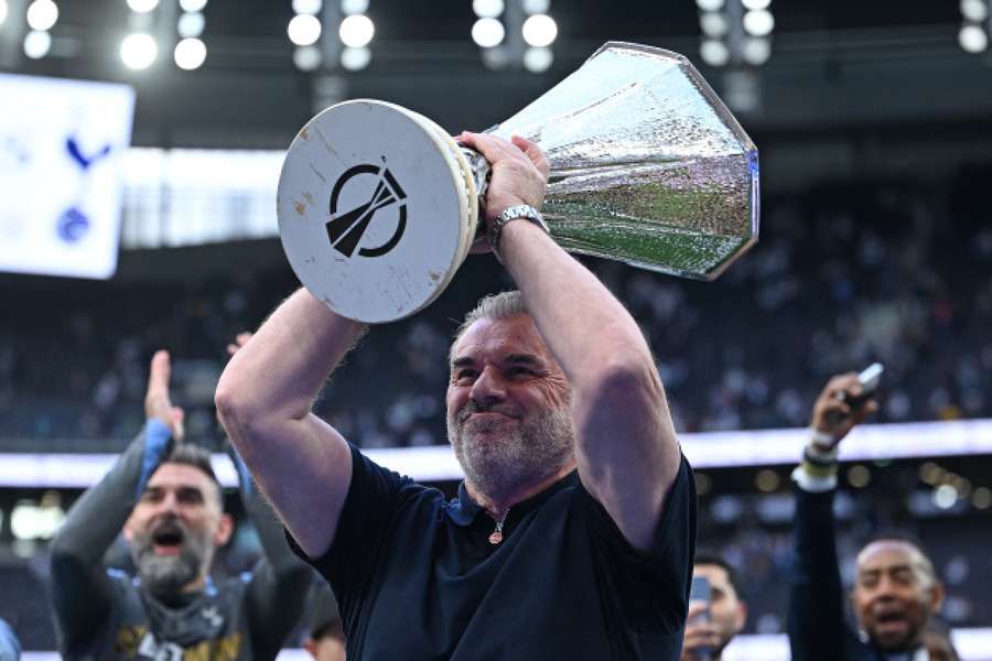 Ange Postecoglou lifts the Europa League trophy
