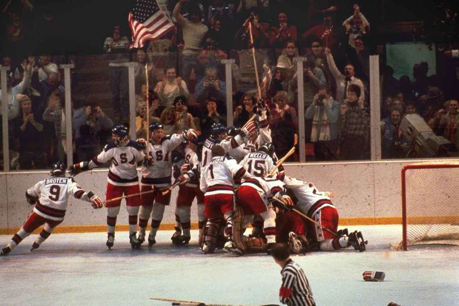 The US hockey team pounces on goalie Jim Craig after a 4-3 victory against the Soviets in the 1980 Olympics
