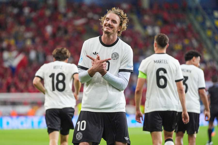 Nick Woltemade celebrates his fourth goal of the tournament
