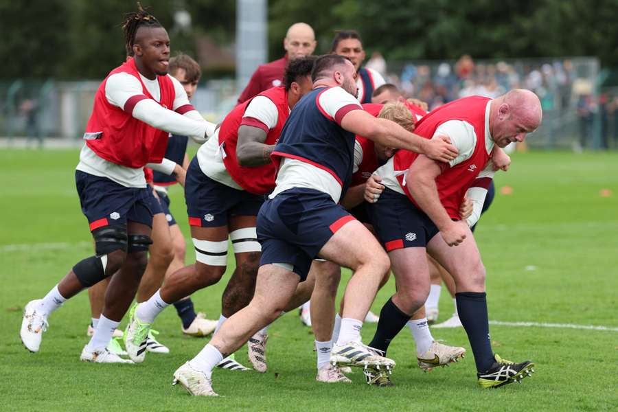 England's prop Dan Cole (R) leads a maul supported by flanker Jack Willis (2R) and locks Courtney Lawes (2L) and Maro Itoje (L) during a training session