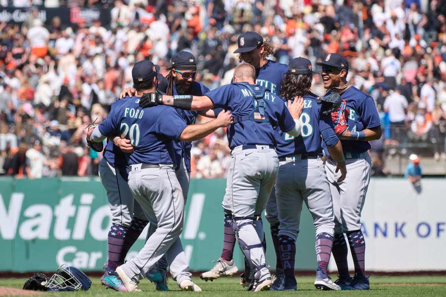 Seattle Mariners celebrate the win against the San Francisco Giants after the final out ninth inning