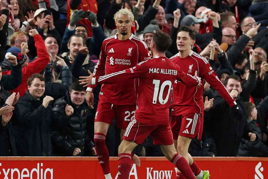Liverpool's Hugo Ekitike celebrates scoring their second goal with Florian Wirtz and Alexis Mac Allister