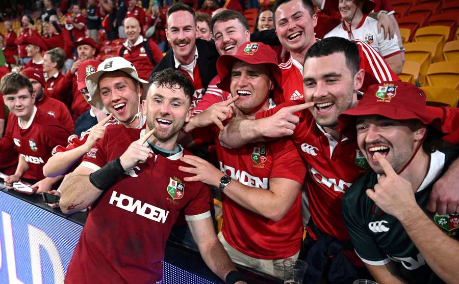 British & Irish Lions' Hugo Keenan celebrates with fans after the match