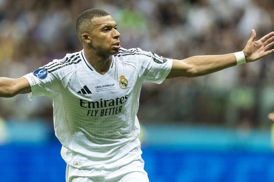 Mbappe celebrates after scoring his first goal for his new club