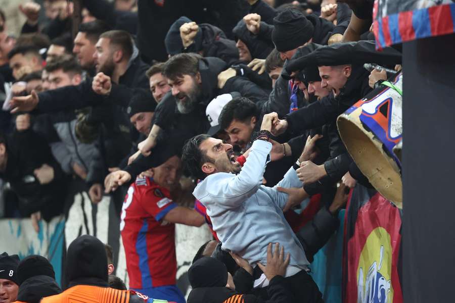 FCSB's head coach Elias Charalambous celebrates with fans FCSB's head coach Elias Charalambous celebrates with fans